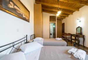 a room with two beds and a table with a mirror at Villa Kaladare - Private Pool & Quiet Relaxing Stay in Kalandares +48 photos