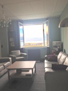 a living room with a couch and a coffee table at Villa Sophie in Trouville-sur-Mer