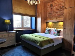 Postel nebo postele na pokoji v ubytování SleepWell Apartments Ordynacka + 37 fotografií