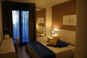 מיטה או מיטות בחדר ב-Apart Hotel Atlantic