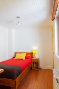 Cama ou camas em um quarto em Hostal Rio Amazonas