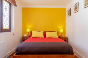 Cama ou camas em um quarto em Hostal Rio Amazonas