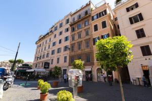a street with a pay phone in front of a building at Arenula Luxury Apartment in Rome