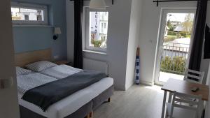 Postel nebo postele na pokoji v ubytování Willa Nadbałtycka