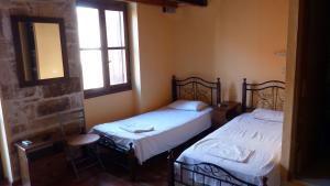 Кровать или кровати в номере Kydonia Rooms