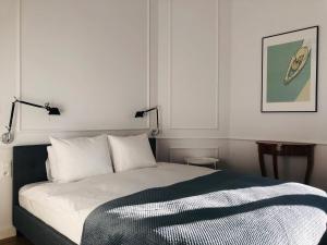 Posteľ alebo postele v izbe v ubytovaní St. Florian Apartament