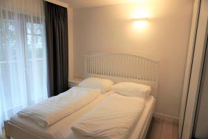 Łóżko lub łóżka w pokoju w obiekcie Rosie | Design | Chalet