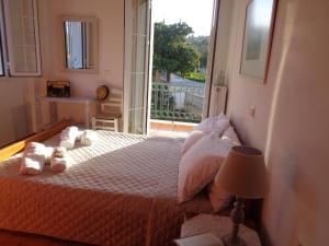 A bed or beds in a room at Melissani House