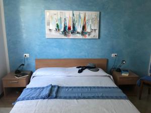 Ein Bett oder Betten in einem Zimmer der Unterkunft Holiday House Ambra