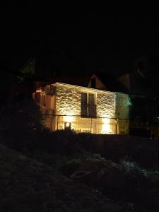 una casa con luces al costado de ella por la noche en Apartments Split, en Split