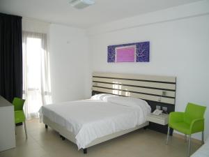 Posteľ alebo postele v izbe v ubytovaní Althea Palace Hotel