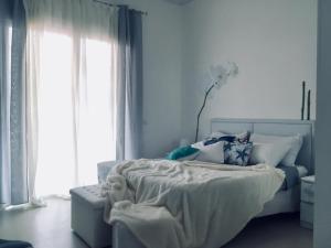 A bed or beds in a room at Heidi's Apartment
