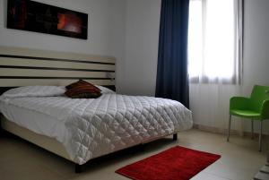 Posteľ alebo postele v izbe v ubytovaní Althea Palace Hotel