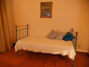 Postel nebo postele na pokoji v ubytování Casa Dos Arrabidos