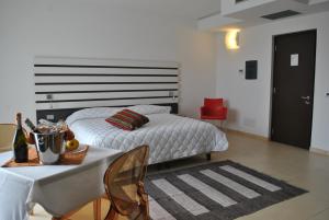 Posteľ alebo postele v izbe v ubytovaní Althea Palace Hotel