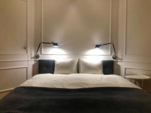Posteľ alebo postele v izbe v ubytovaní St. Florian Apartament