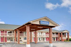 a hotel with a sign that reads tamarack at Travelodge by Wyndham Sellersburg in Sellersburg