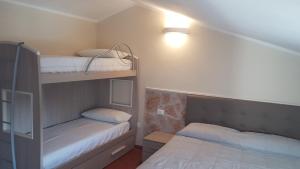 A bed or beds in a room at GARDAWORLD