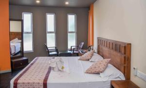 Postel nebo postele na pokoji v ubytování Ceylon Sea Hotel