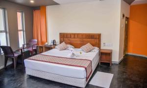 Postel nebo postele na pokoji v ubytování Ceylon Sea Hotel + 37 fotografií