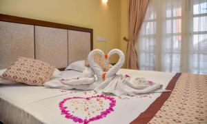 Postel nebo postele na pokoji v ubytování Ceylon Sea Hotel