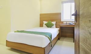 Letto o letti in una camera di Itsy Hotels Jansi Residency