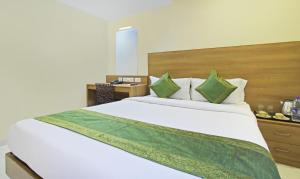 Letto o letti in una camera di Itsy Hotels Jansi Residency