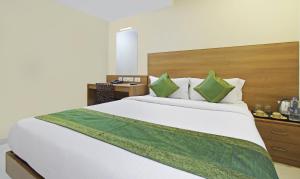 Letto o letti in una camera di Itsy Hotels Jansi Residency