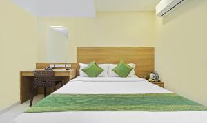 Letto o letti in una camera di Itsy Hotels Jansi Residency