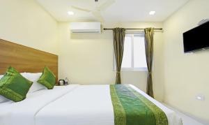 Letto o letti in una camera di Itsy Hotels Jansi Residency