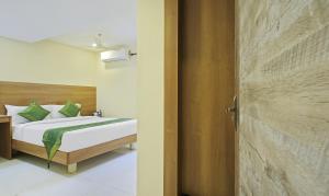 Letto o letti in una camera di Itsy Hotels Jansi Residency