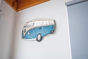a painting of a blue van on a wall at Stunning Waterfront only 10 minutes to Phillip Island - FREE EV UNIT 7kW for electric cars - pet friendly, fireplace FREE WIFI wine & chocolates in Kilcunda +34 photos