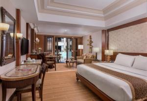 a hotel room with a bed and a desk at Henann Regency Resort and Spa in Boracay