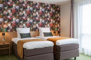 Ліжко або ліжка в номері Best Western Plus Hotel Amstelveen