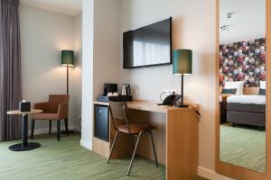 TV a/nebo společenská místnost v ubytování Best Western Plus Hotel Amstelveen