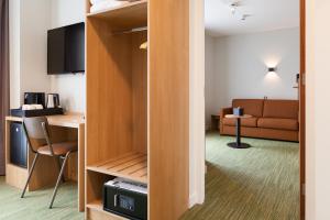TV a/nebo společenská místnost v ubytování Best Western Plus Hotel Amstelveen