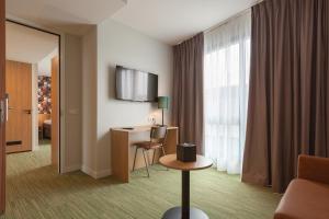 TV tai viihdekeskus majoituspaikassa Best Western Plus Hotel Amstelveen
