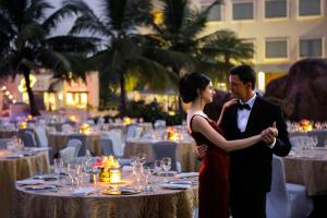 a man and a woman standing in front of a table at Novotel Hyderabad Convention Centre in Hyderabad +37 photos