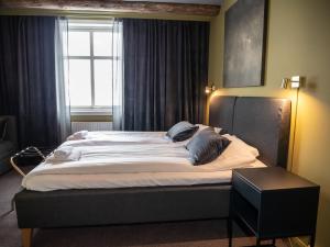 Postel nebo postele na pokoji v ubytování Hotell Gamla Staden