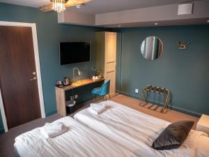 Postel nebo postele na pokoji v ubytování Hotell Gamla Staden