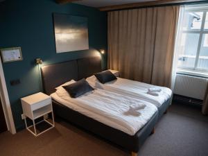Postel nebo postele na pokoji v ubytování Hotell Gamla Staden