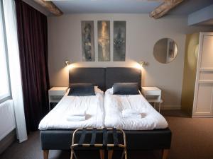 Postel nebo postele na pokoji v ubytování Hotell Gamla Staden