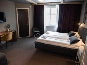 Postel nebo postele na pokoji v ubytování Hotell Gamla Staden