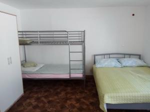 a room with two bunk beds and a room with a bed at pokój blisko morza in Kołobrzeg