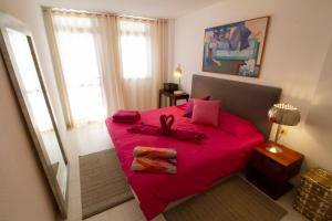 Posteľ alebo postele v izbe v ubytovaní MEDANO4YOU Red Square Dream Holiday Home