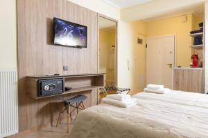 Televízia a/alebo spoločenská miestnosť v ubytovaní Seven Heaven Premium Suites