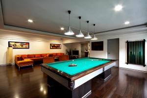 a living room with a pool table in it at All Time Relais & Sport Hotel in Rome