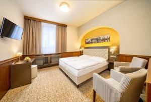 Postel nebo postele na pokoji v ubytování Hotel Zlatá hvězda