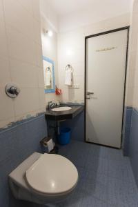 a bathroom with a toilet and a sink at Aristo Hospitality Services Apartment, 1402,14th Floor in Mumbai