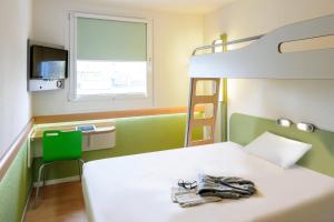 Ein Bett oder Betten in einem Zimmer der Unterkunft Ibis budget Wien Sankt Marx